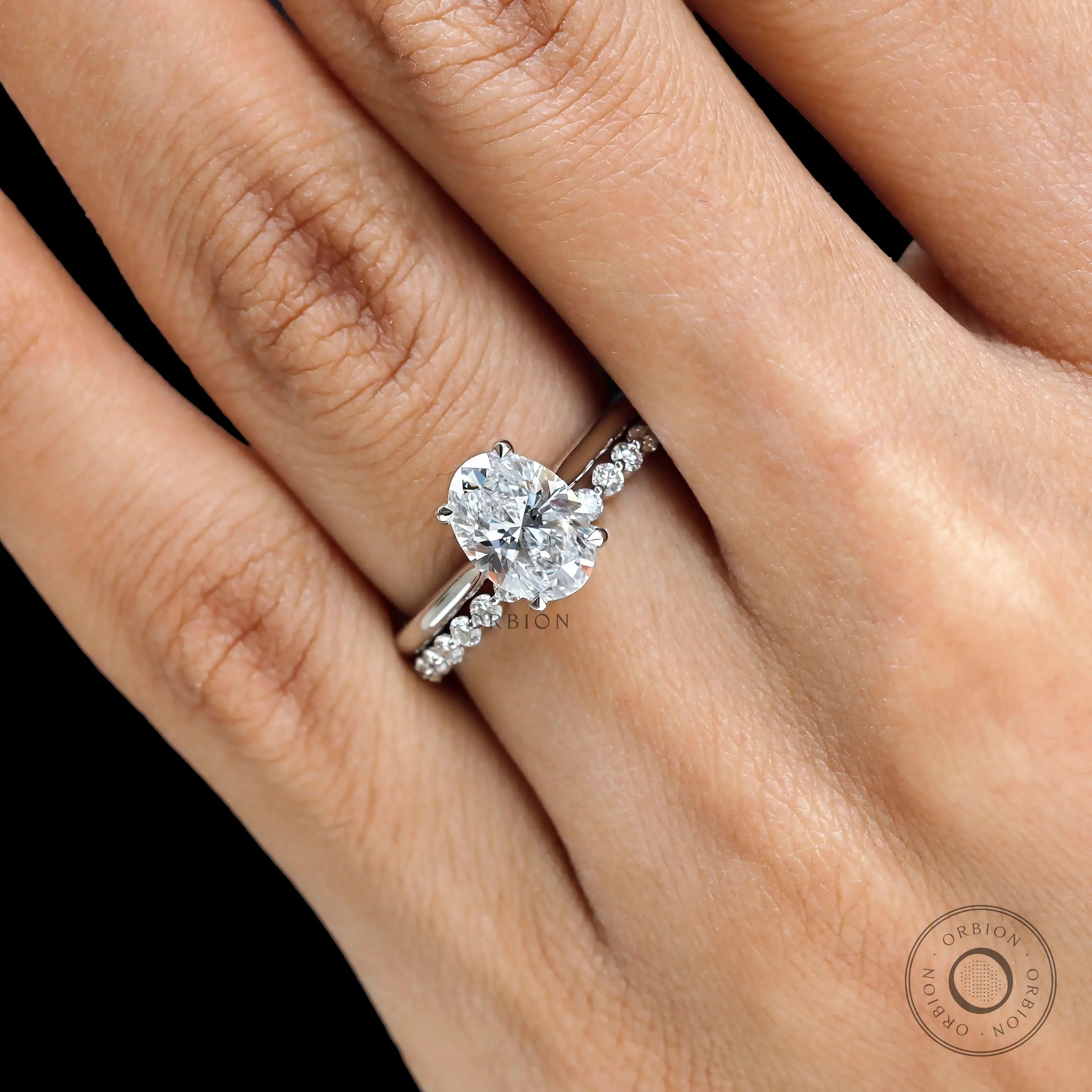 Elegant oval bridal ring set on hand