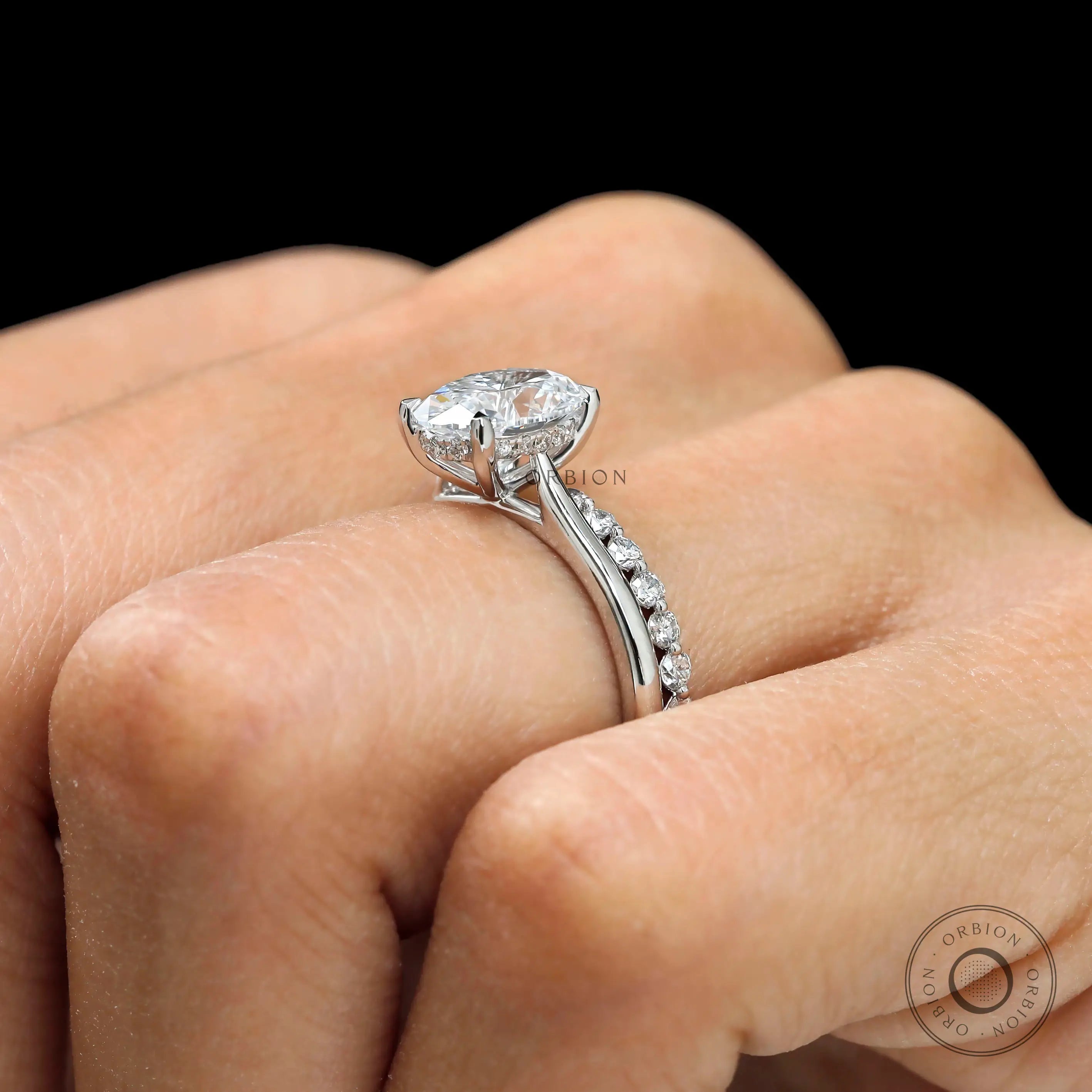 Hidden halo oval diamond engagement ring close up