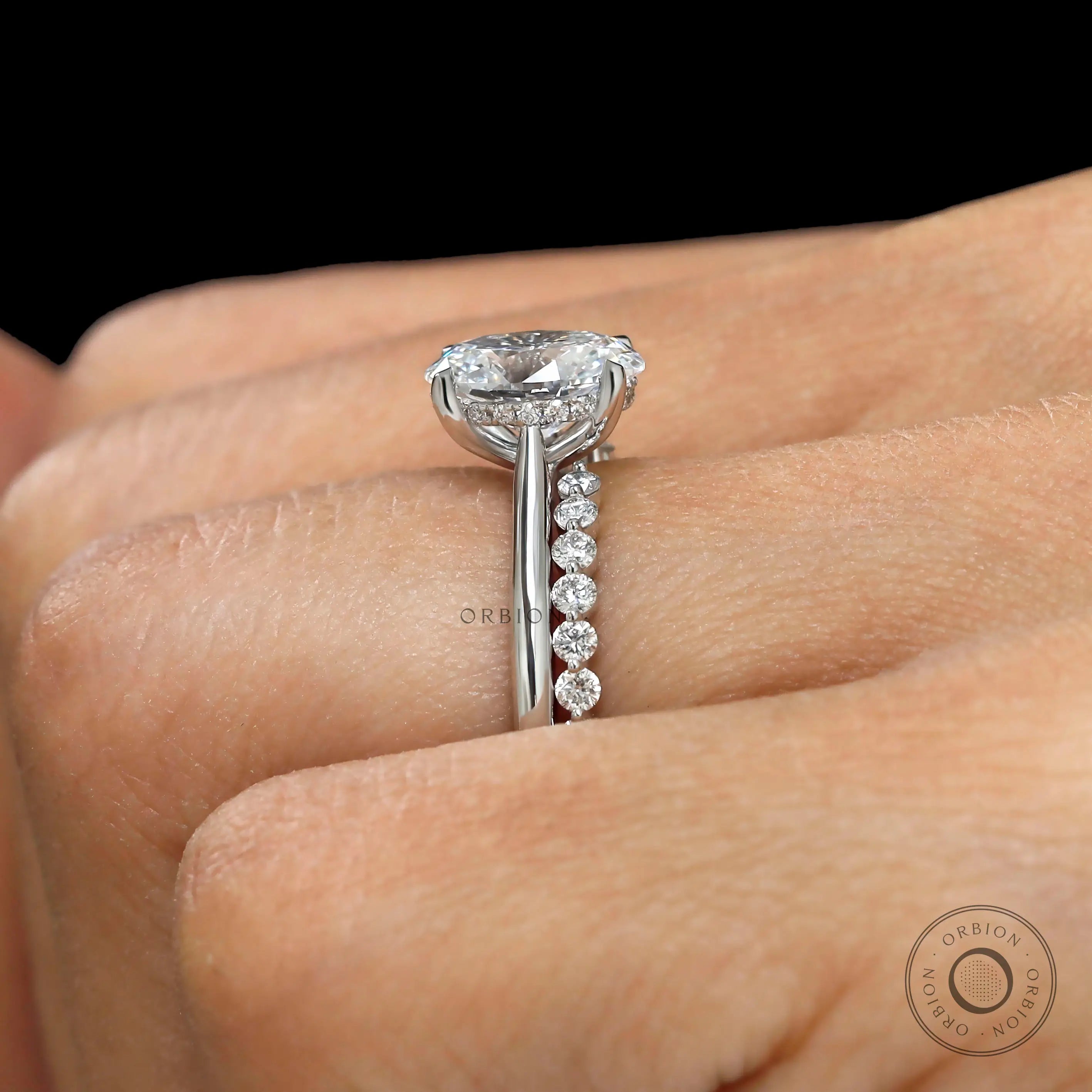 Cathedral style oval engagement ring side view