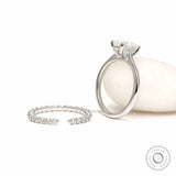 White gold oval engagement ring with hidden halo detail
