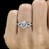 Platinum engagement ring featuring pear-shaped lab diamond, split shank