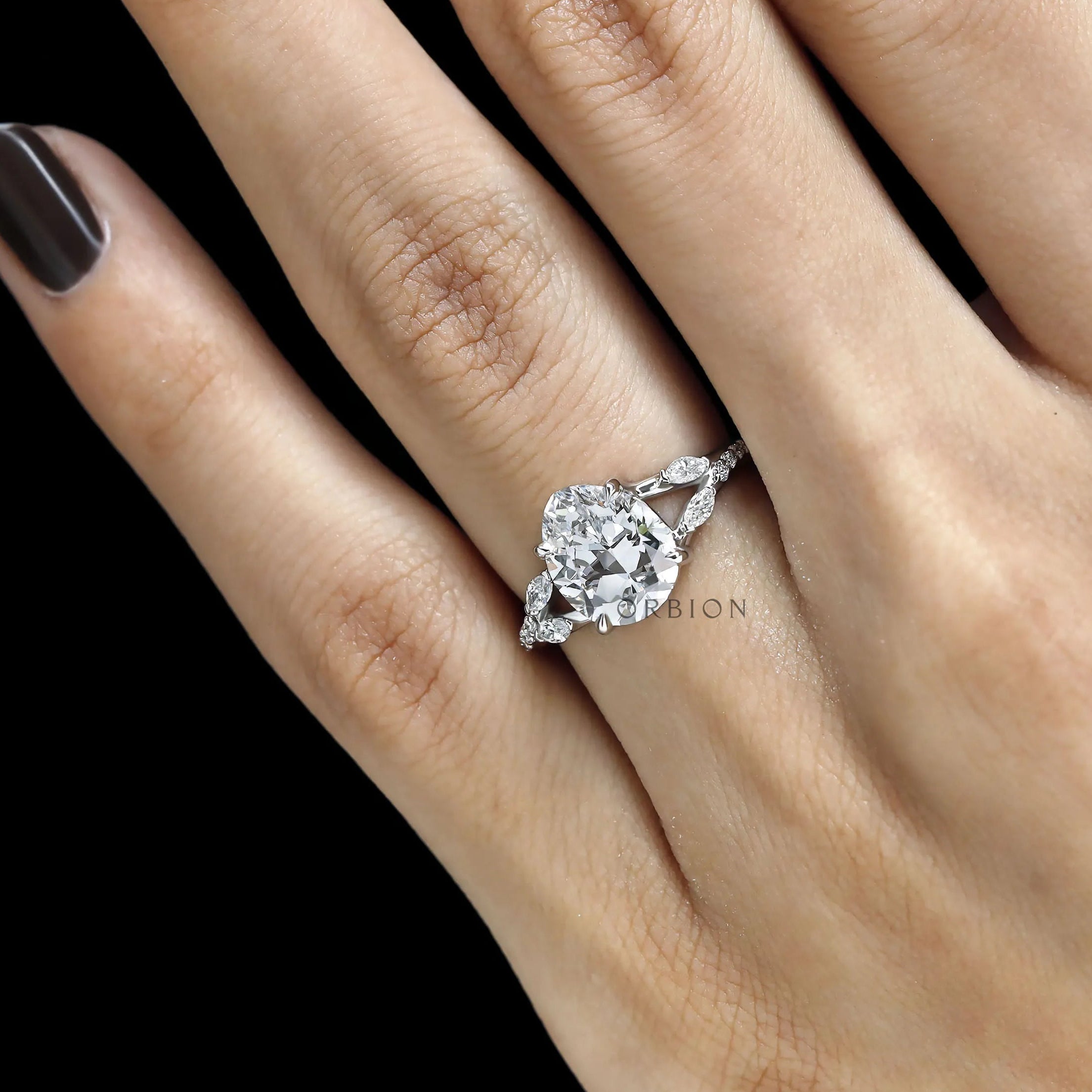 Fat pear lab grown diamond platinum solitaire with split shank and marquise round accent details