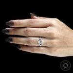 Stunning platinum engagement ring with fat pear lab diamond, split shank, marquise and round accents