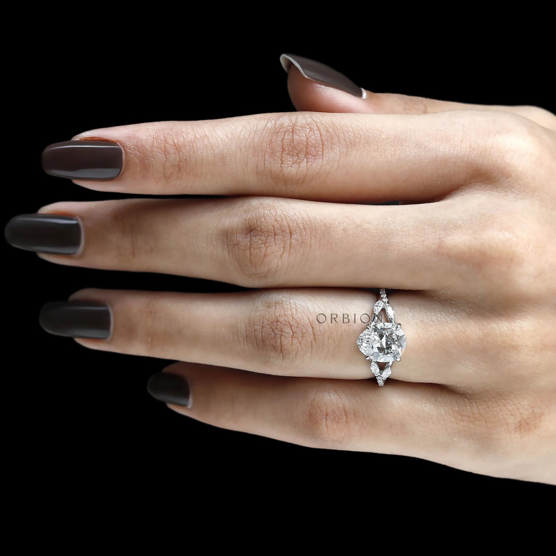 Stunning platinum engagement ring with fat pear lab diamond, split shank, marquise and round accents