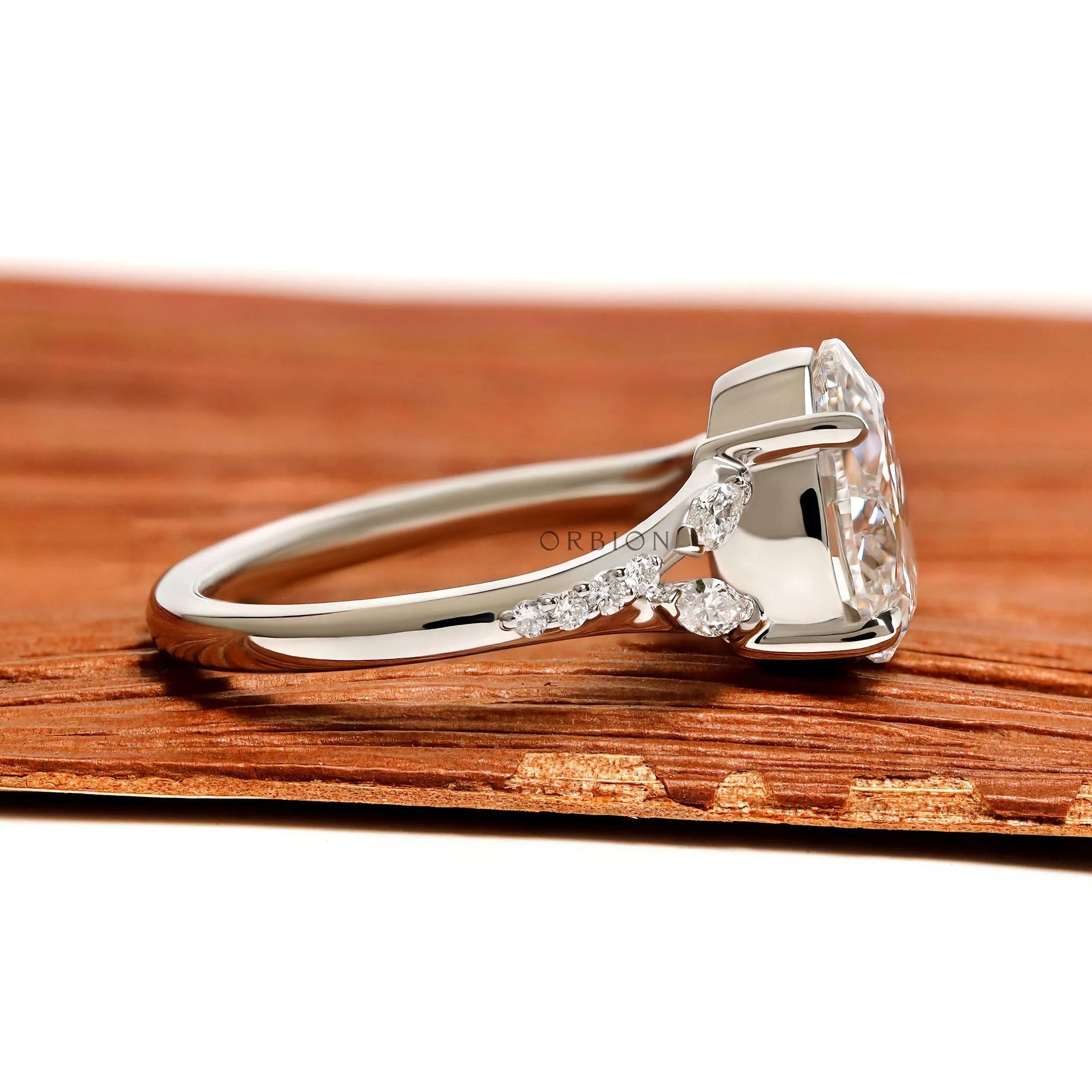 Elegant fat pear lab grown diamond ring in platinum with split shank and marquise round accents