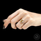 Pear champagne moissanite engagement ring worn on hand