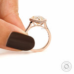 Pear moissanite halo ring with pave shoulder stones