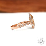 Side view pear moissanite halo cathedral ring with pave diamonds