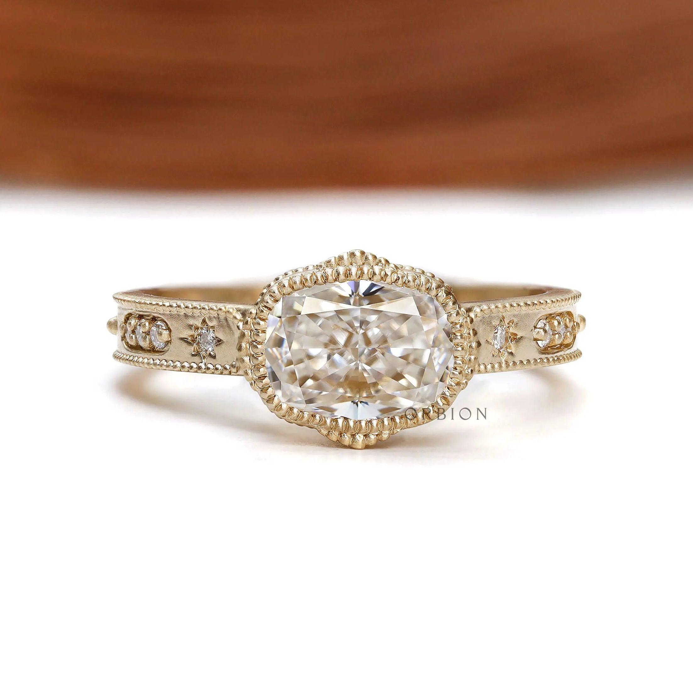 Vintage art deco cushion moissanite engagement ring with milgrain bezel and starburst design