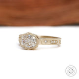 Art deco engagement ring with bezel set cushion moissanite thick gold band