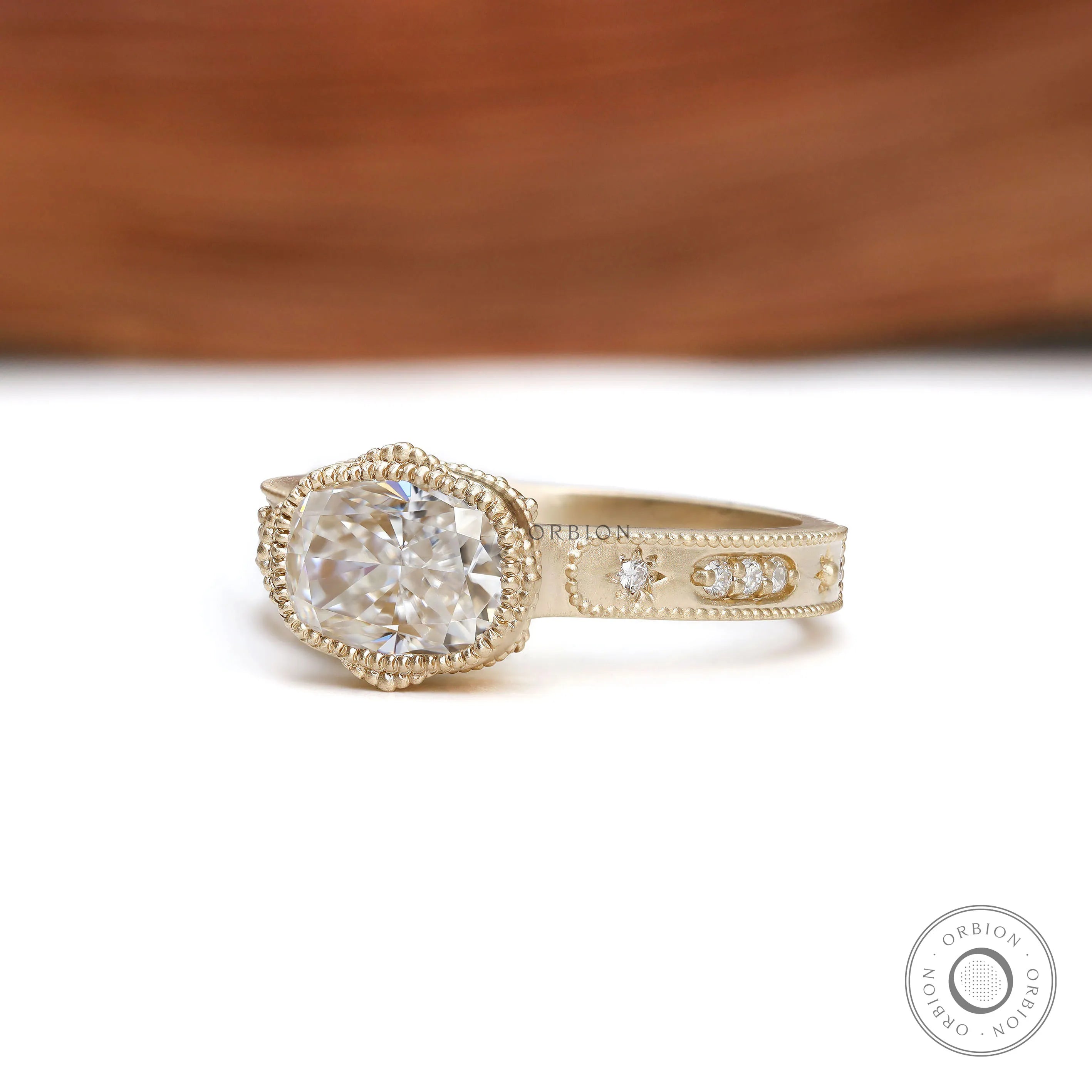 Art deco engagement ring with bezel set cushion moissanite thick gold band