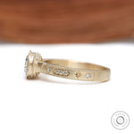 Vintage style cushion moissanite ring with milgrain detail and matte gold band