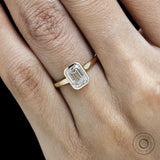 Refined emerald cut lab diamond bezel ring for engagement