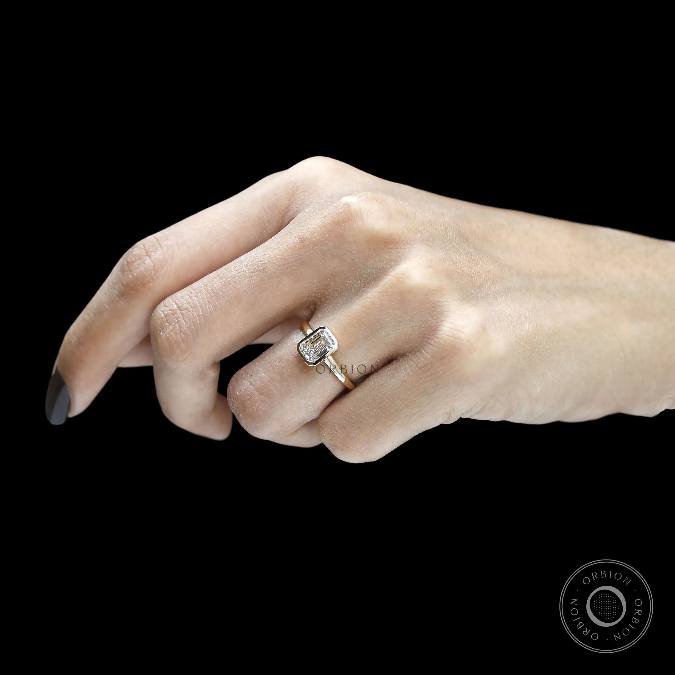 Sleek emerald cut lab diamond engagement ring with bezel mount