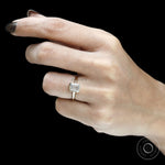 Contemporary floating emerald cut diamond ring in yellow gold