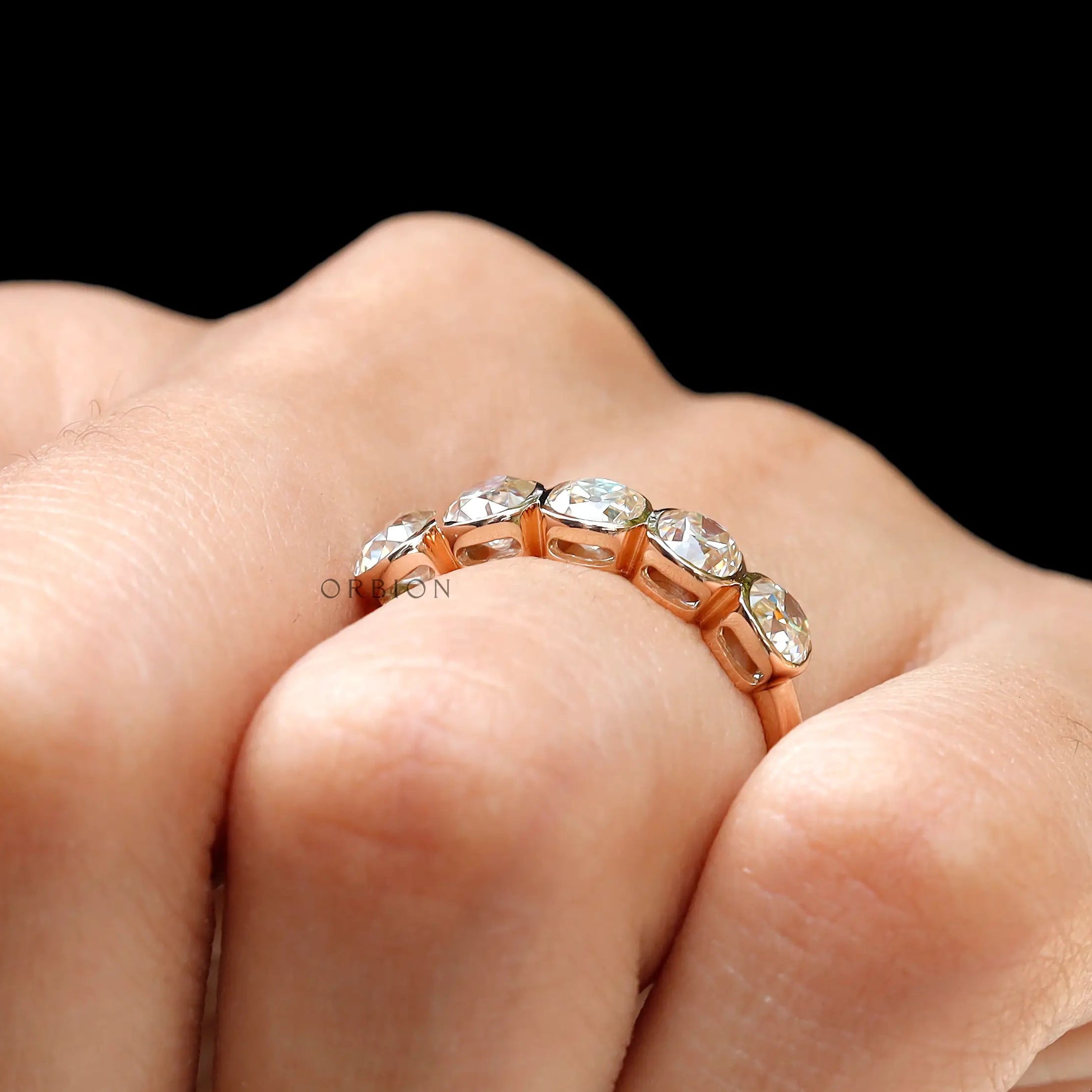 Angled hand shot showing bezel set stones across knuckle