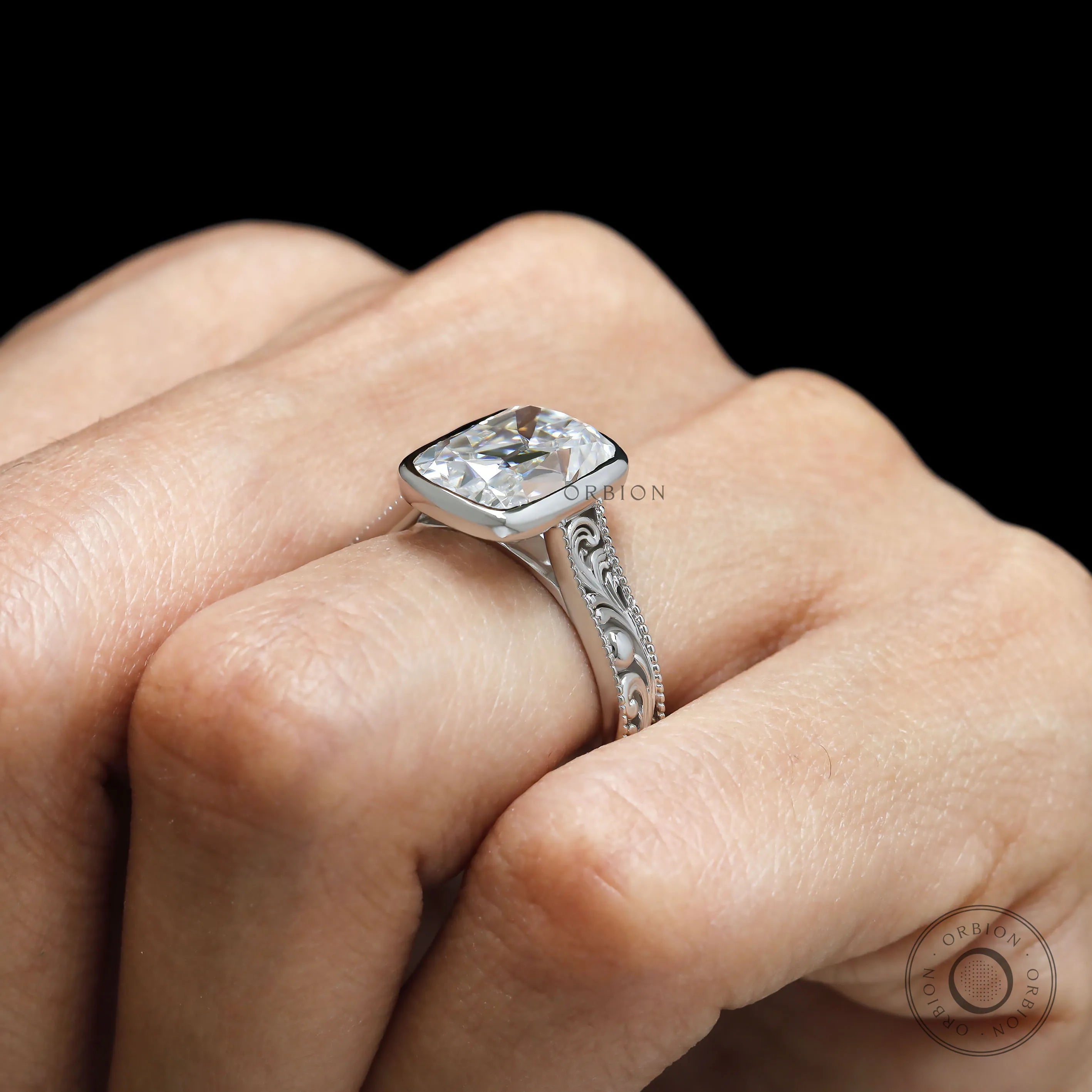 Detailed scroll engraving ring with elongated cushion moissanite in white gold