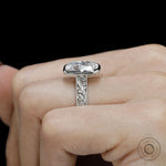 Antique inspired bezel ring with milgrain edges and cushion cut stone