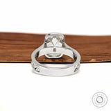 Ornate scrollwork ring with milgrain bezel and cushion moissanite stone