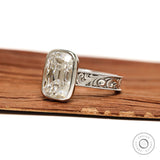 Antique scrollwork bezel ring with elongated cushion moissanite in 14k white gold