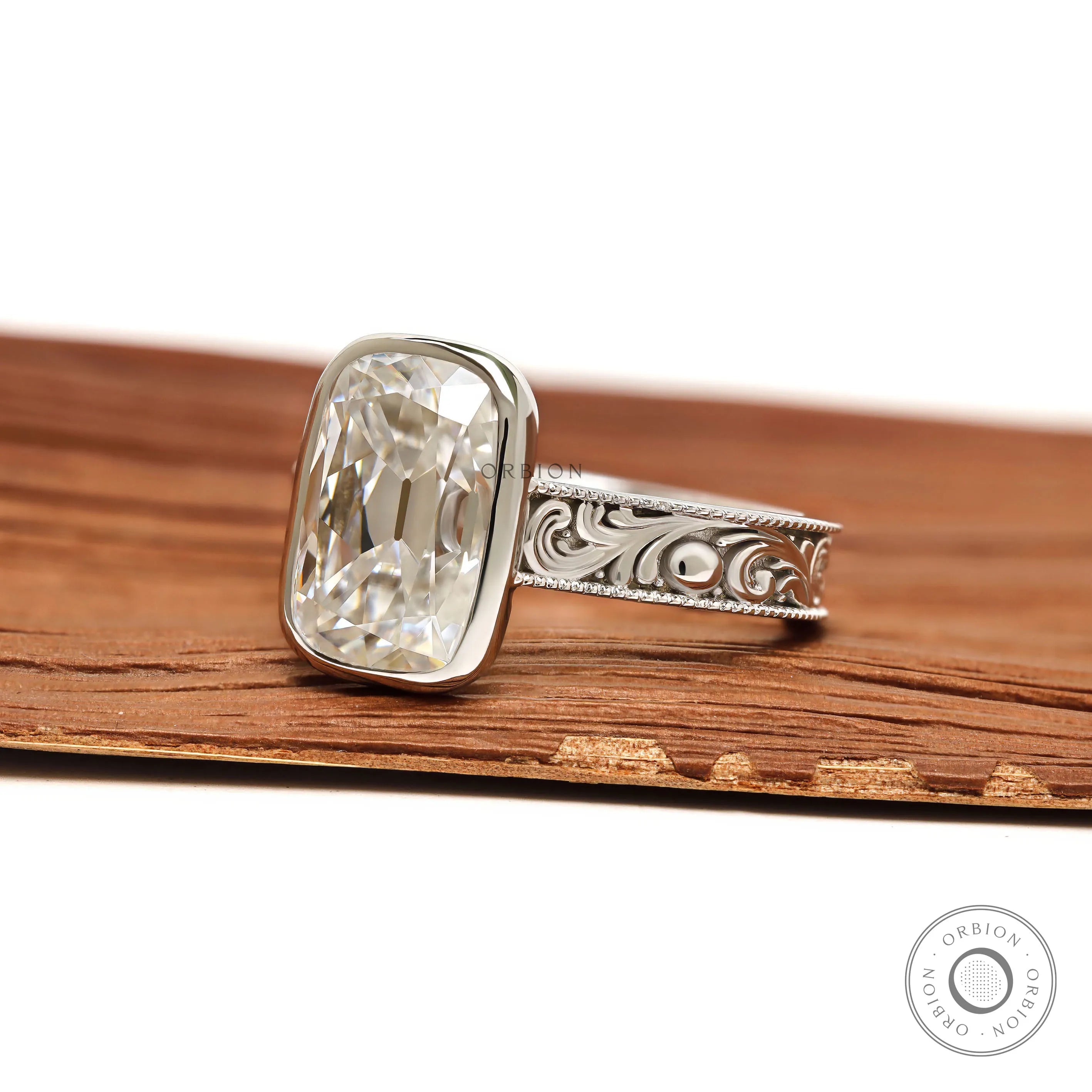 Antique scrollwork bezel ring with elongated cushion moissanite in 14k white gold