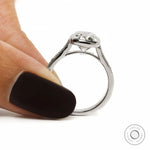 Cathedral setting ring with engraved details and bezel set cushion diamond