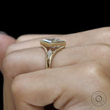 Split shank three stone engagement ring with lozenge cut moissanite and kite accents