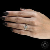Lozenge cut moissanite three stone engagement ring with split shank and kite detailing