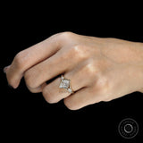Modern three stone engagement ring with bezel set lozenge cut moissanite in yellow gold