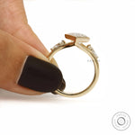 14k Yellow gold split shank ring with lozenge moissanite center and side stones