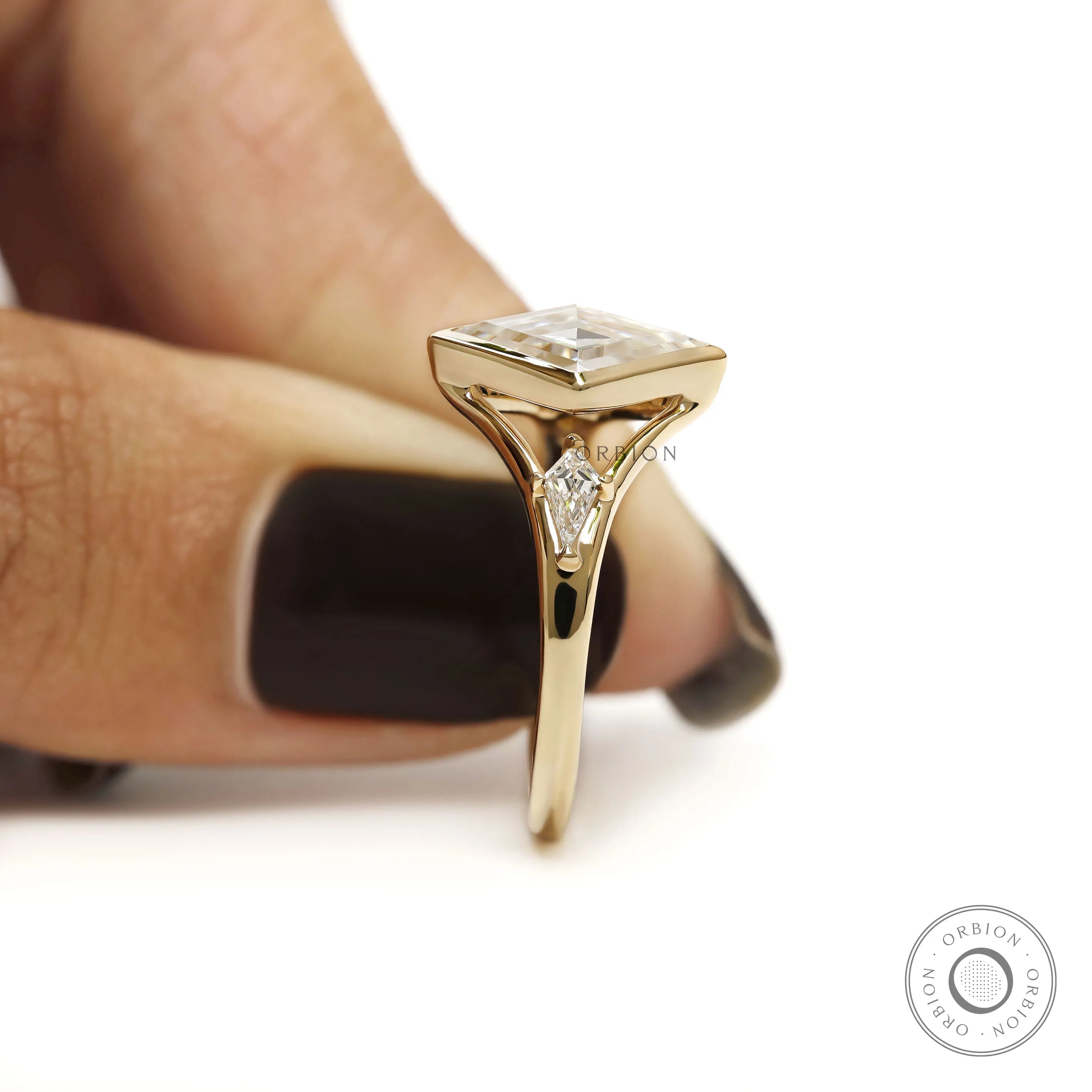 Moissanite engagement ring with lozenge cut and kite accent stones in 14k gold