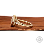 14k Yellow gold engagement ring with bezel set lozenge moissanite and kite accents