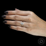 Stunning oval diamond hidden halo engagement ring in 18k yellow gold