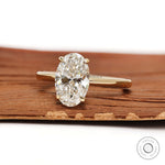 2 CT oval lab grown diamond ring with hidden halo setting in 18k yellow gold