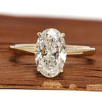 Hidden halo 2 CT oval cut lab grown diamond engagement ring with yellow gold band