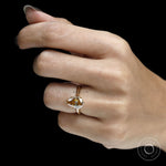 Unique tulip set pear moissanite ring with floral bridge, dark champagne stone