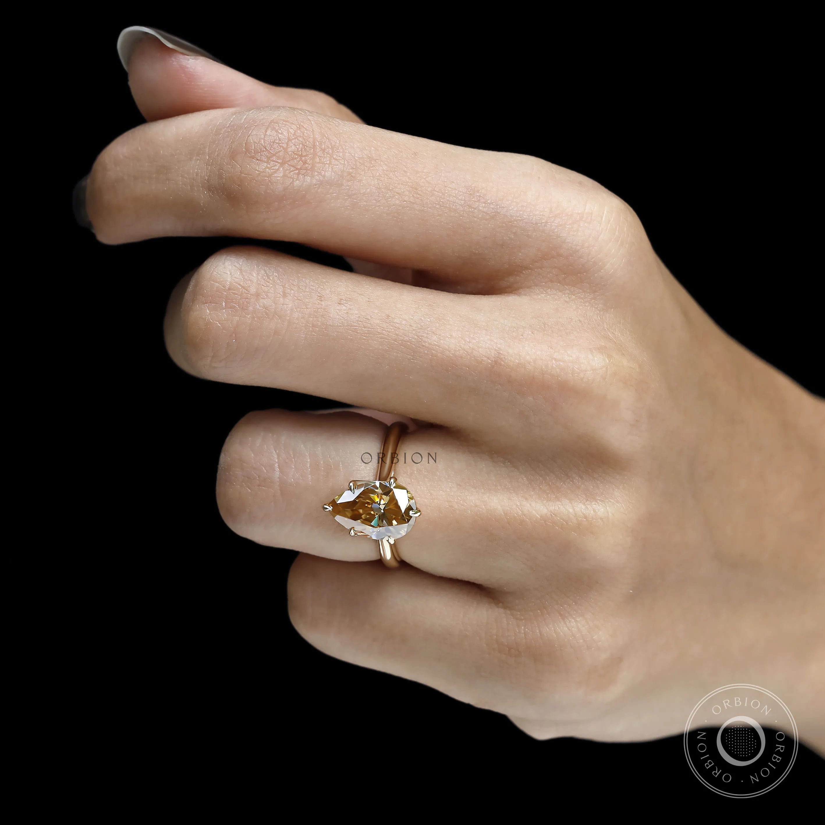 Unique tulip set pear moissanite ring with floral bridge, dark champagne stone