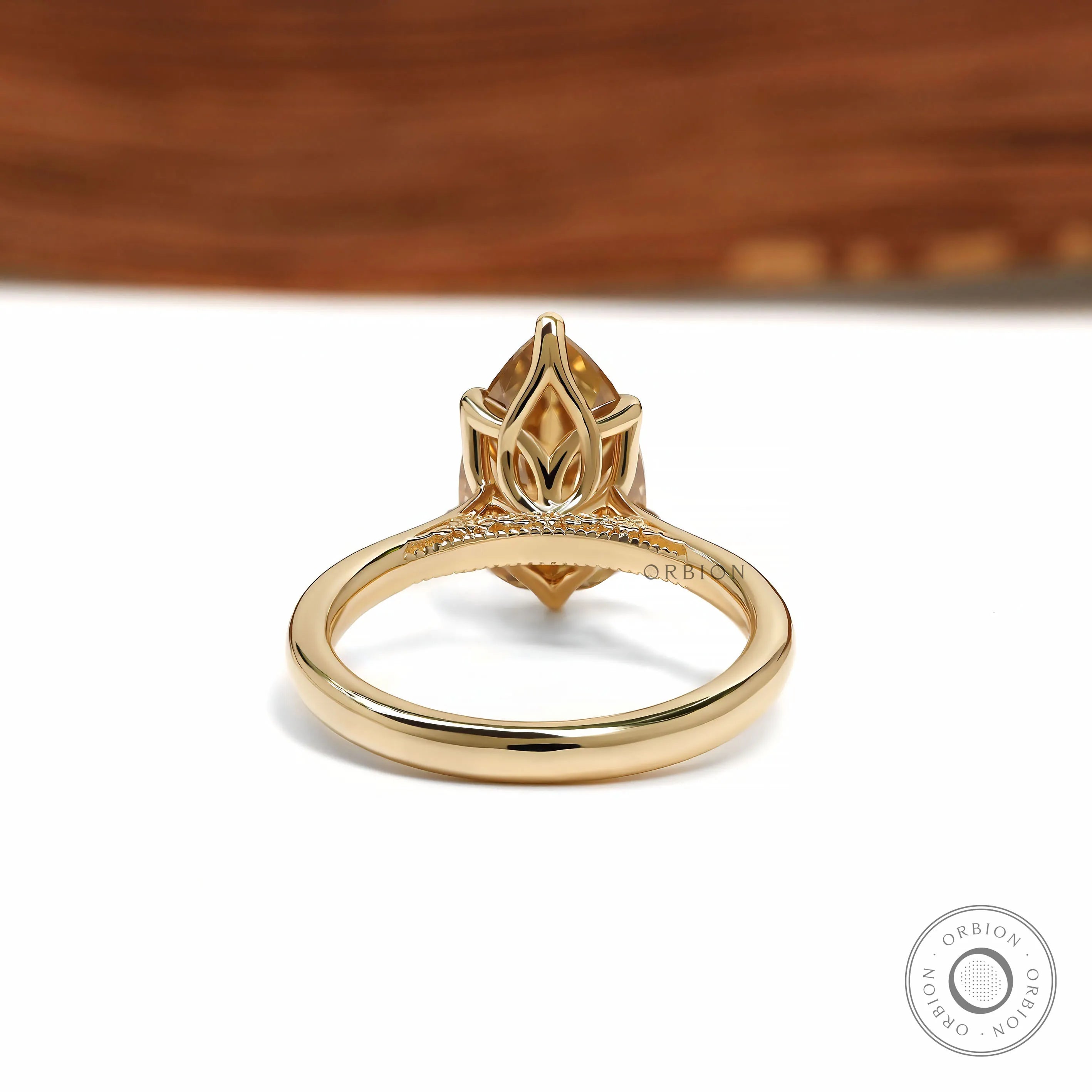 Floral bridge design ring with pear dark champagne moissanite tulip setting