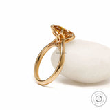 Elegant tulip set pear moissanite ring with dark champagne stone in 18k yellow gold