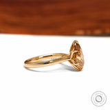 Pear dark champagne moissanite tulip ring with floral bridge 