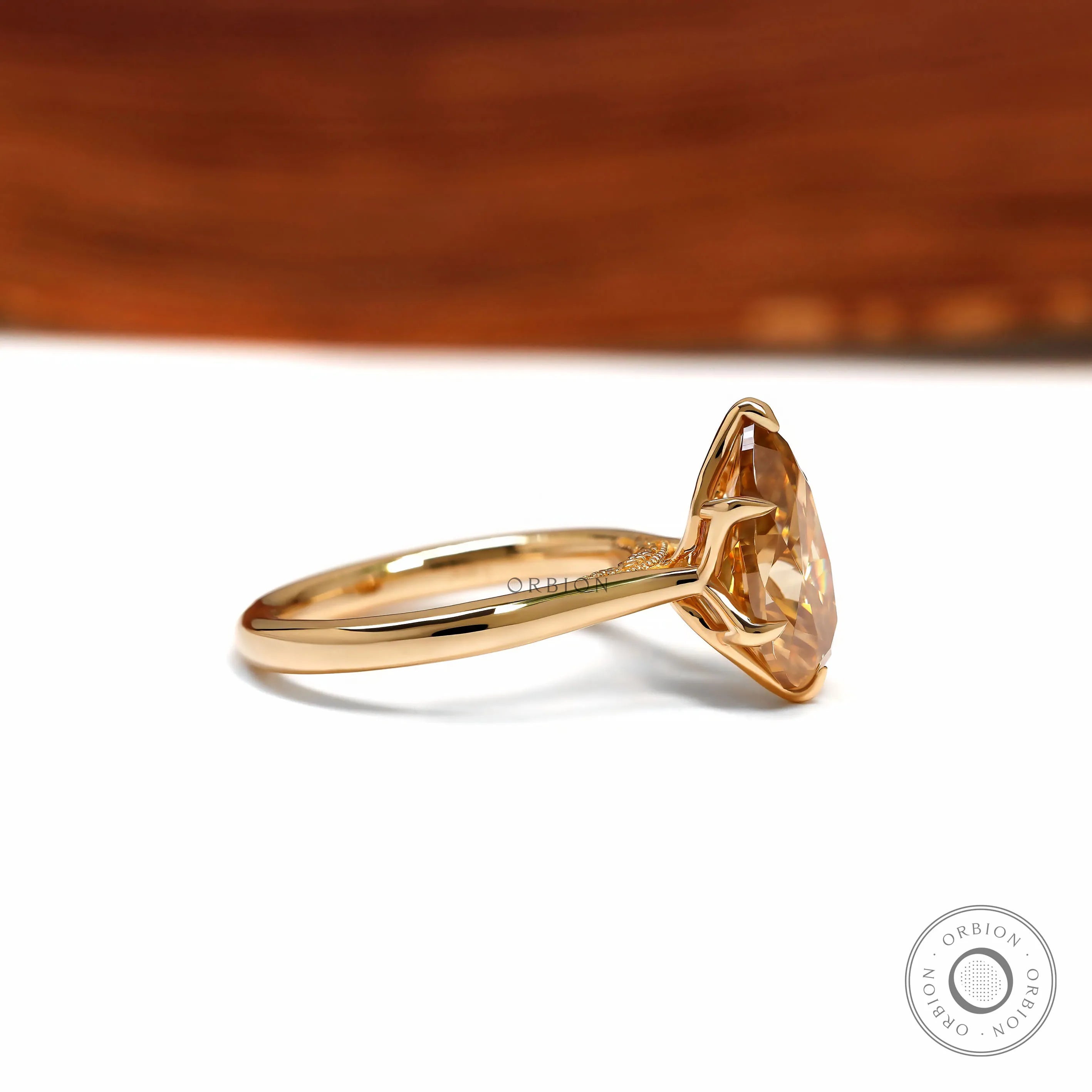 Pear dark champagne moissanite tulip ring with floral bridge 