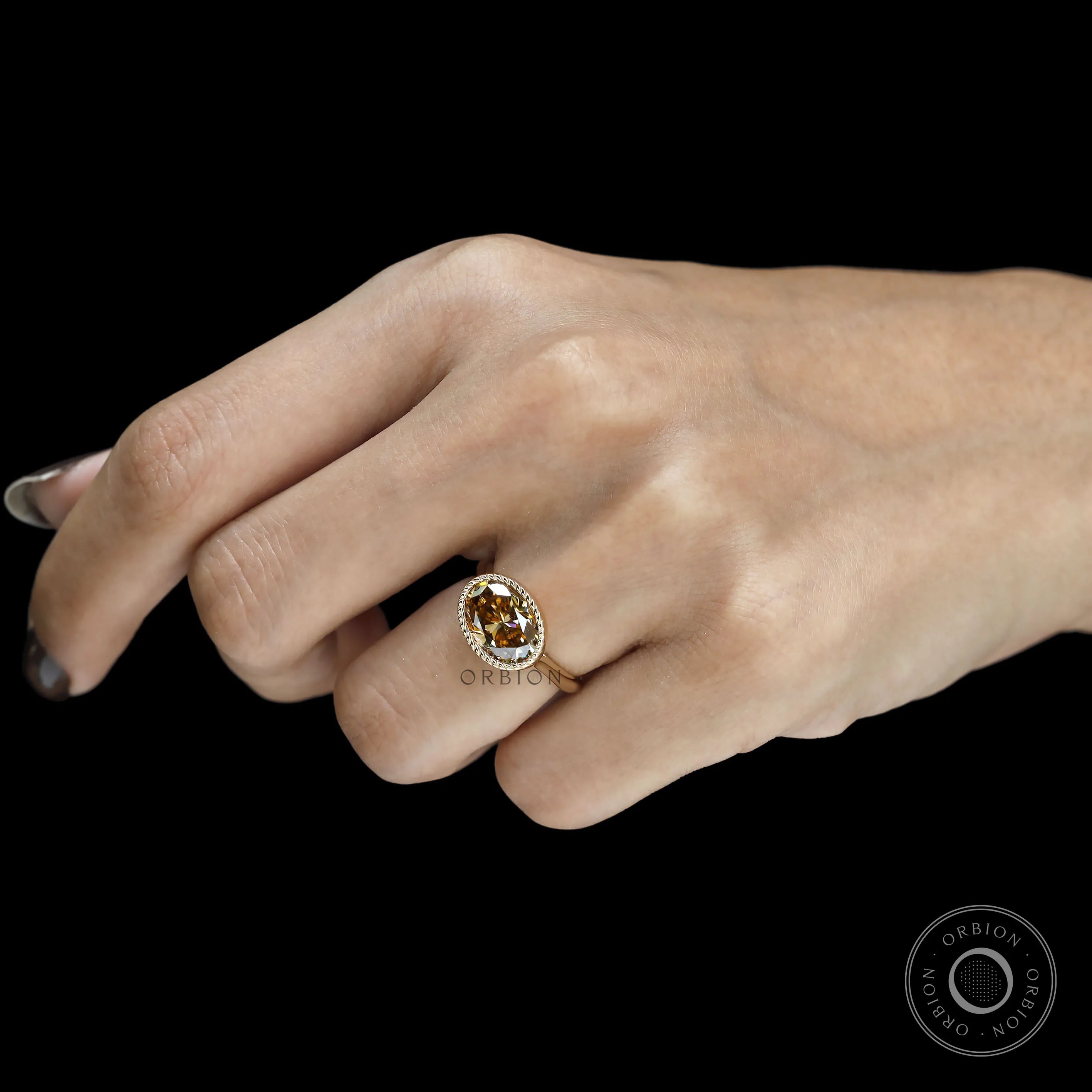 Unique East West orientation oval dark champagne moissanite ring, tulip set, 18k yellow gold