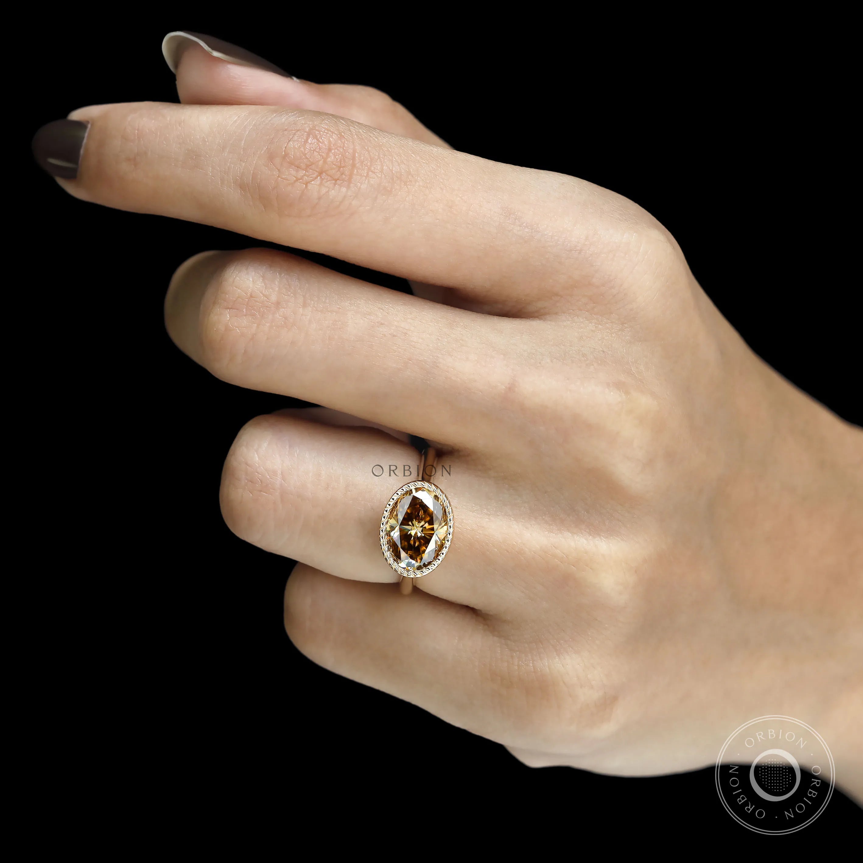 East West oval dark champagne moissanite cocktail ring with rope bezel and tulip setting, cathedral band