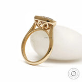 Elegant East West oval dark champagne moissanite cocktail ring with tulip setting and rope bezel