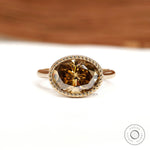 East West oval dark champagne moissanite cocktail ring with tulip setting and rope bezel in 18k yellow gold
