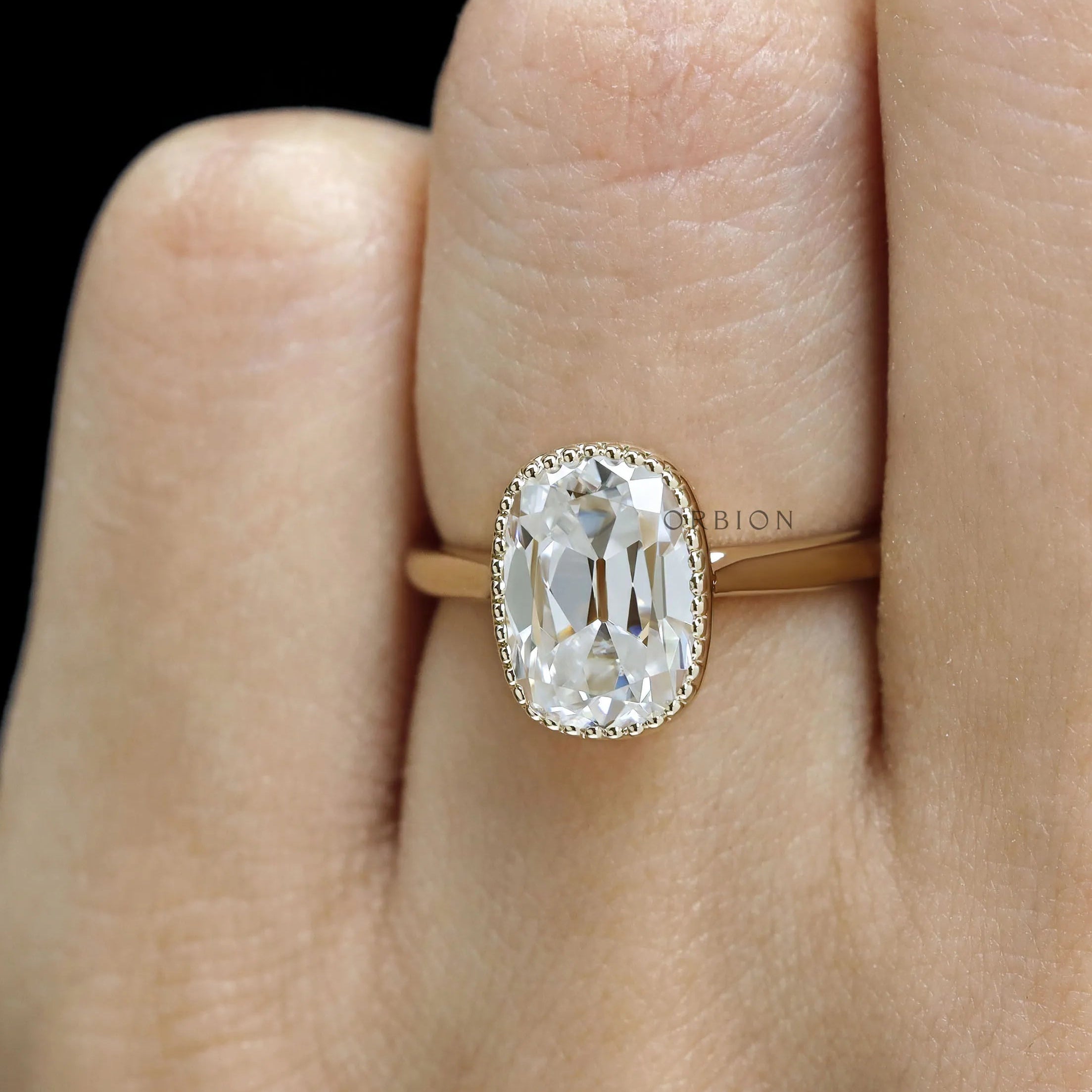 OMC elongated cushion moissanite engagement ring, milgrain bezel, 10k yellow gold cathedral setting
