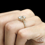 10k yellow gold cathedral engagement ring featuring elongated cushion OMC moissanite with milgrain bezel