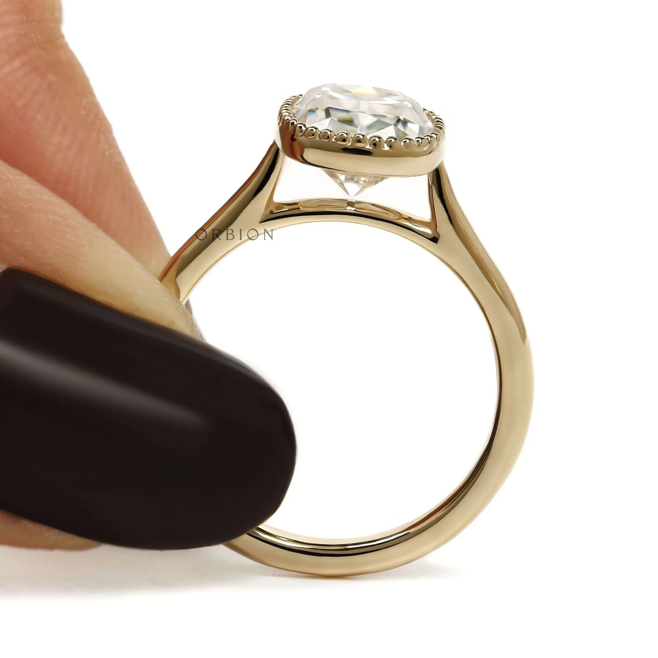 Elongated cushion OMC moissanite ring with milgrain bezel, 10k yellow gold cathedral