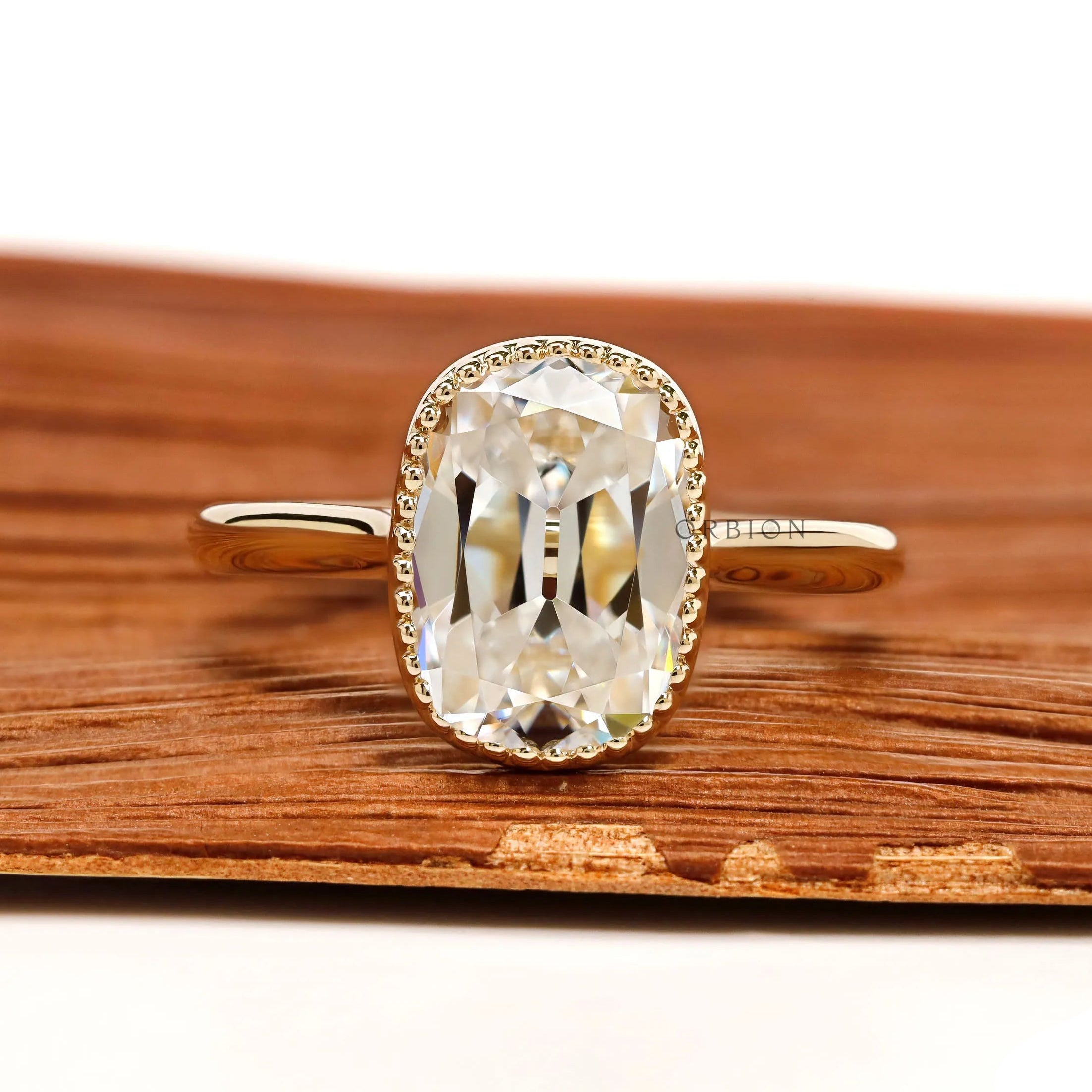 Elongated cushion moissanite milgrain bezel ring in 10k yellow gold cathedral, vintage style