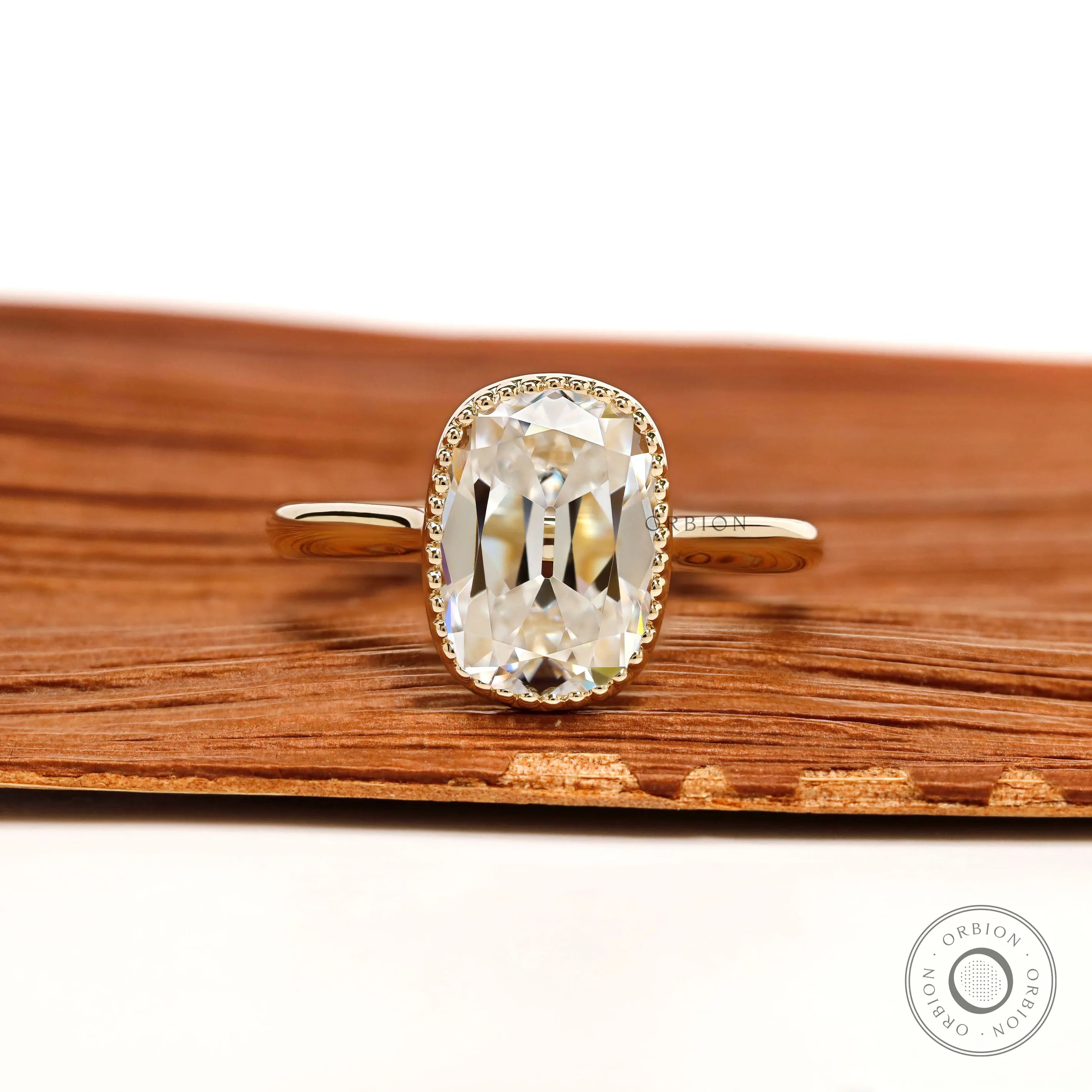 Elongated cushion moissanite milgrain bezel ring in 10k yellow gold cathedral, vintage style
